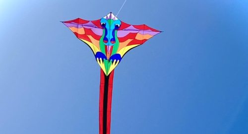 colorful dragon kite against blue sky